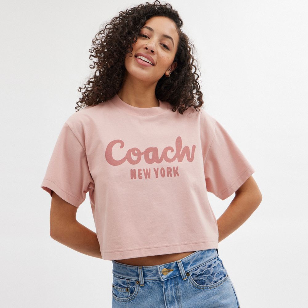 Women Coach Cursive Signature Cropped T Shirts Pink | CA_CH67153