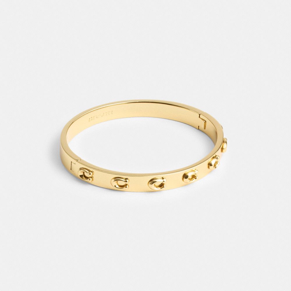 Women Coach Pegged Signature Hinged Bangle Bangles Gold | CA_CH26845